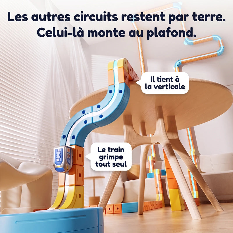 Les autres circuits restent par terre : celui-la monte le long de la table, le train grimpe tout seul