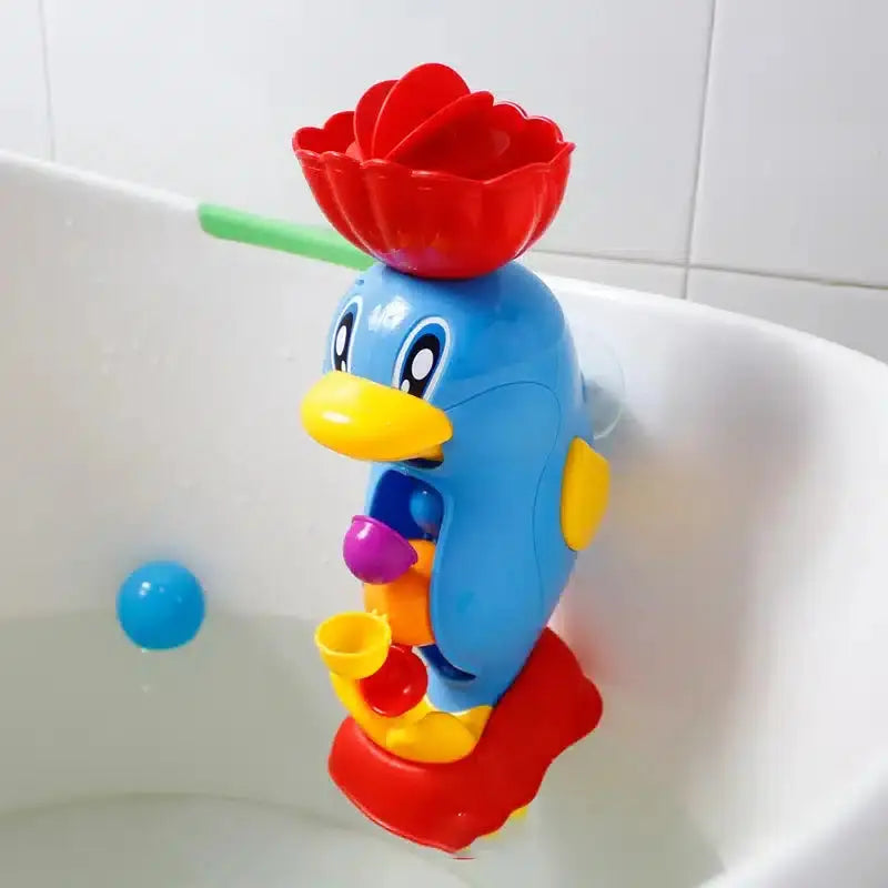 Un Jouet de Bain Déversoir à accrocher à la baignoire accroché à la baignoire.