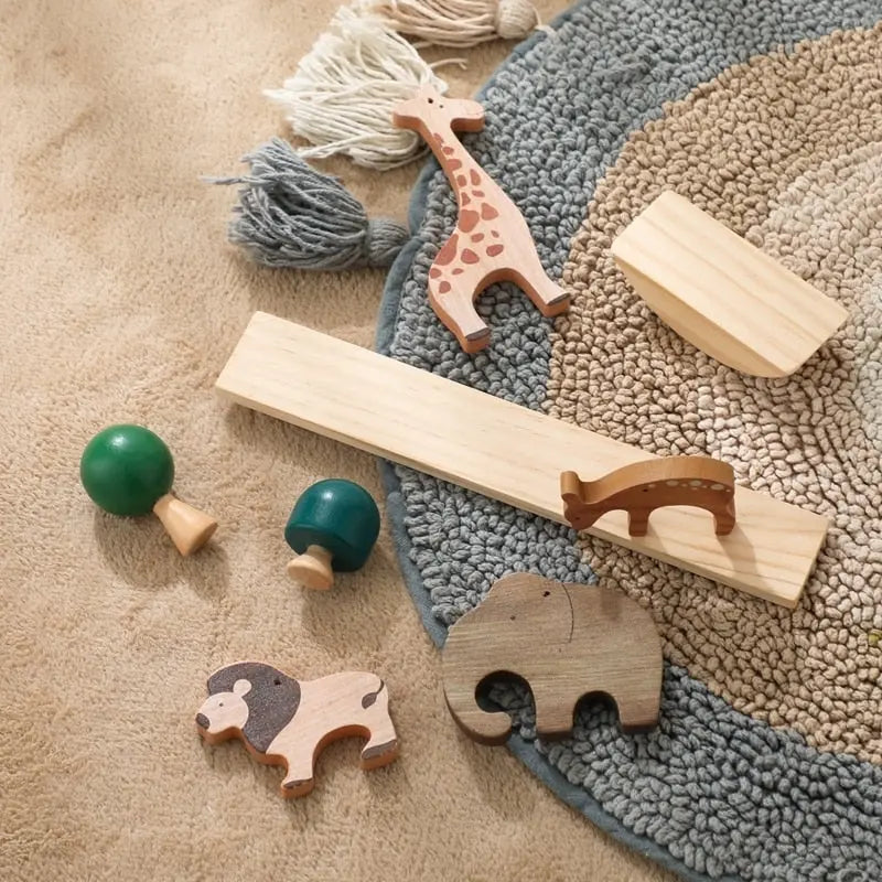 Un ensemble de jeux d'équilibre Animaux et Dinosaure en Bois avec des girafes, des éléphants et des zèbres.