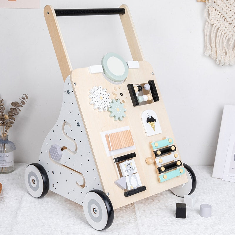 Trotteur pousseur bébé avec ses multiples activités