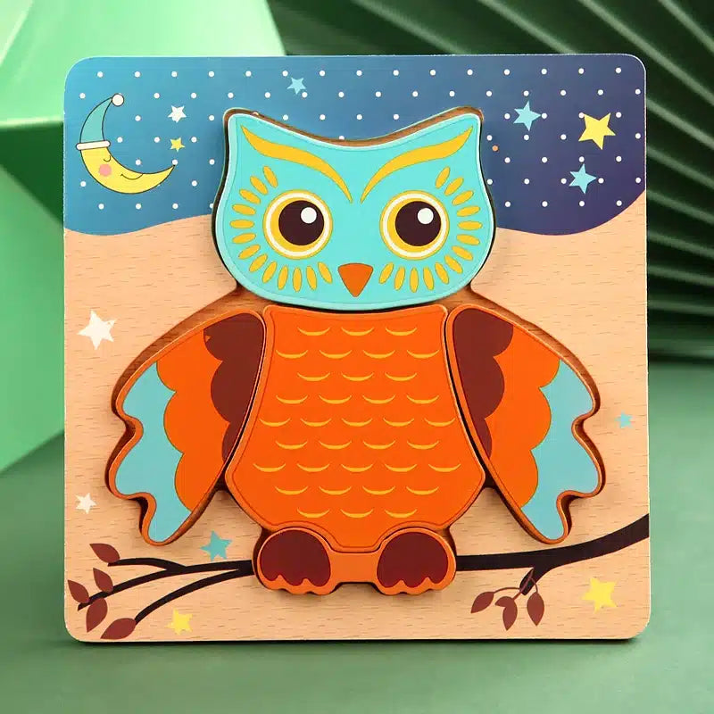 Un puzzle en bois représentant un hibou assis sur une branche.