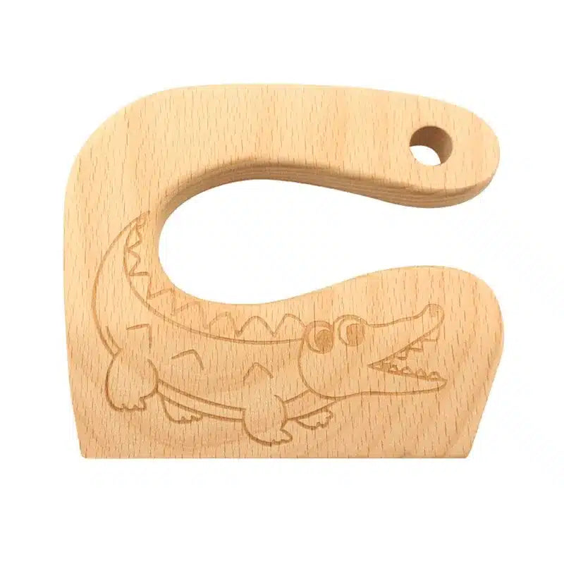 Un jouet en bois avec un crocodile dessus.