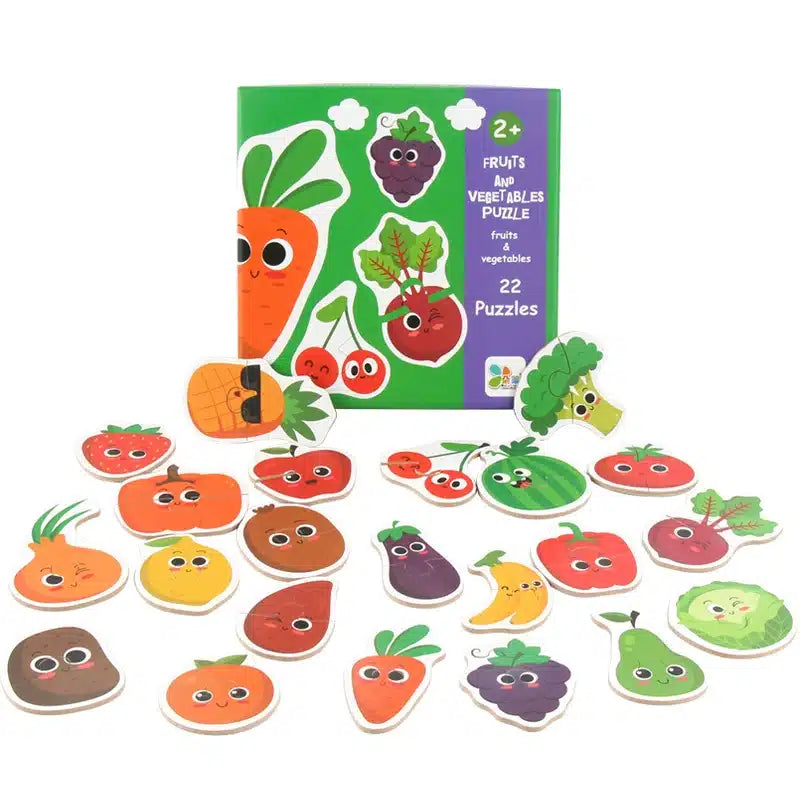 Un ensemble d'aimants fruits et légumes dans une boîte.