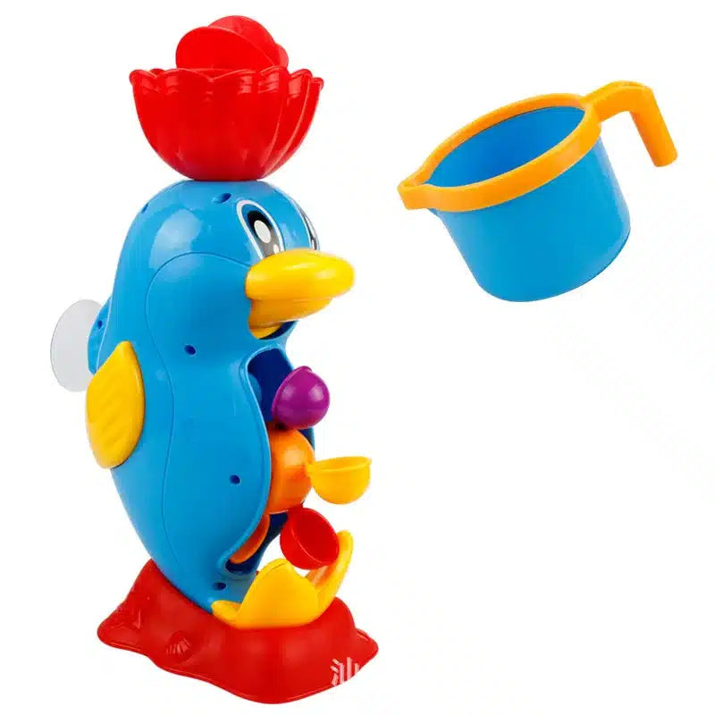 Un canard jouet avec une tasse et un seau.