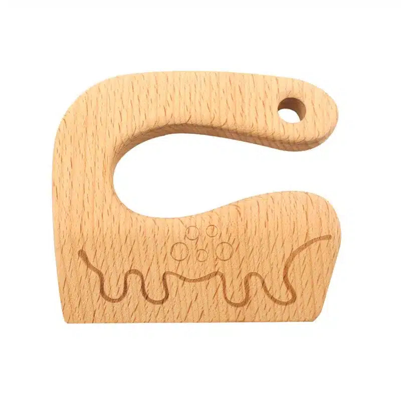 Un anneau de dentition en bois avec un animal dessus.