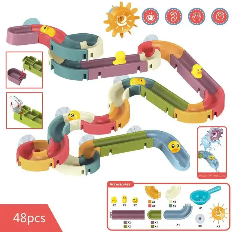 Un ensemble de jouets en plastique colorés avec un soleil dessus, conçu comme Jouet de Bain Tobogan Canard à Ventouse Baignoire.