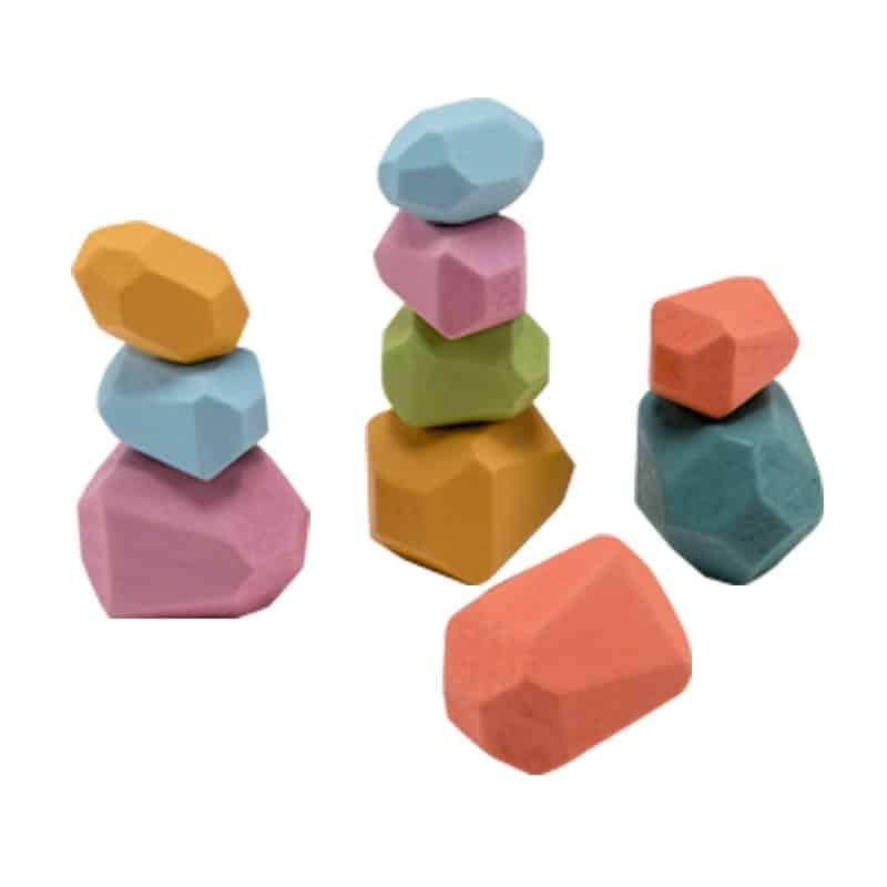 Un ensemble de Bloc de Construction en Bois en Forme de Pierres Colorées sur fond blanc.