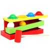 Jeu à Marteler en Bois 4 Couleurs avec des boules et un marteau.