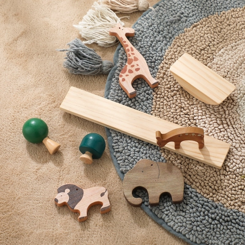 Un ensemble de jeux d'équilibre Animaux et Dinosaure en Bois avec des girafes, des éléphants et des zèbres.