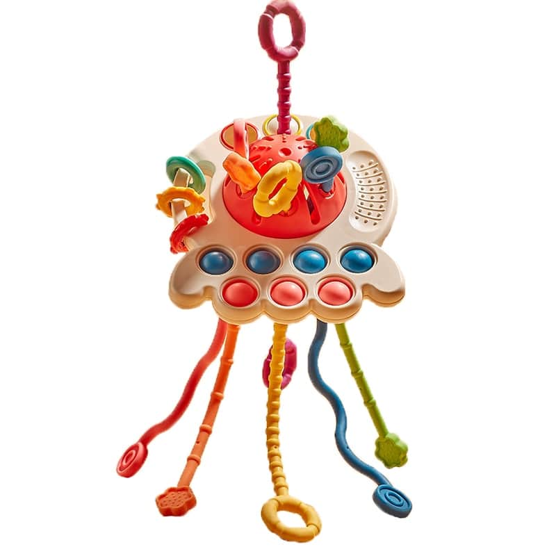 Un Jouet Sensoriel Bébé avec de nombreux boutons colorés.
