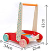 Un Pousseur Bébé - Jeu de Construction en bois avec un design à pois rouge et bleu.
