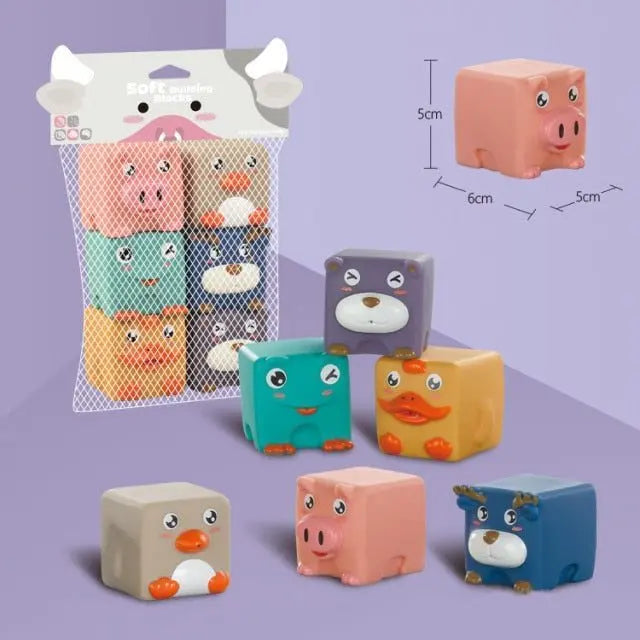 Six Cubes d’éveil bébé en silicone – Animaux, en forme d’animaux colorés et mesurant 5 cm x 6 cm x 5 cm, sont soigneusement présentés dans un emballage en filet, parfait pour les mains curieuses de bébé.