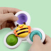 Une main tenant un jouet fidget Spinner de Bain pour Baignoire.